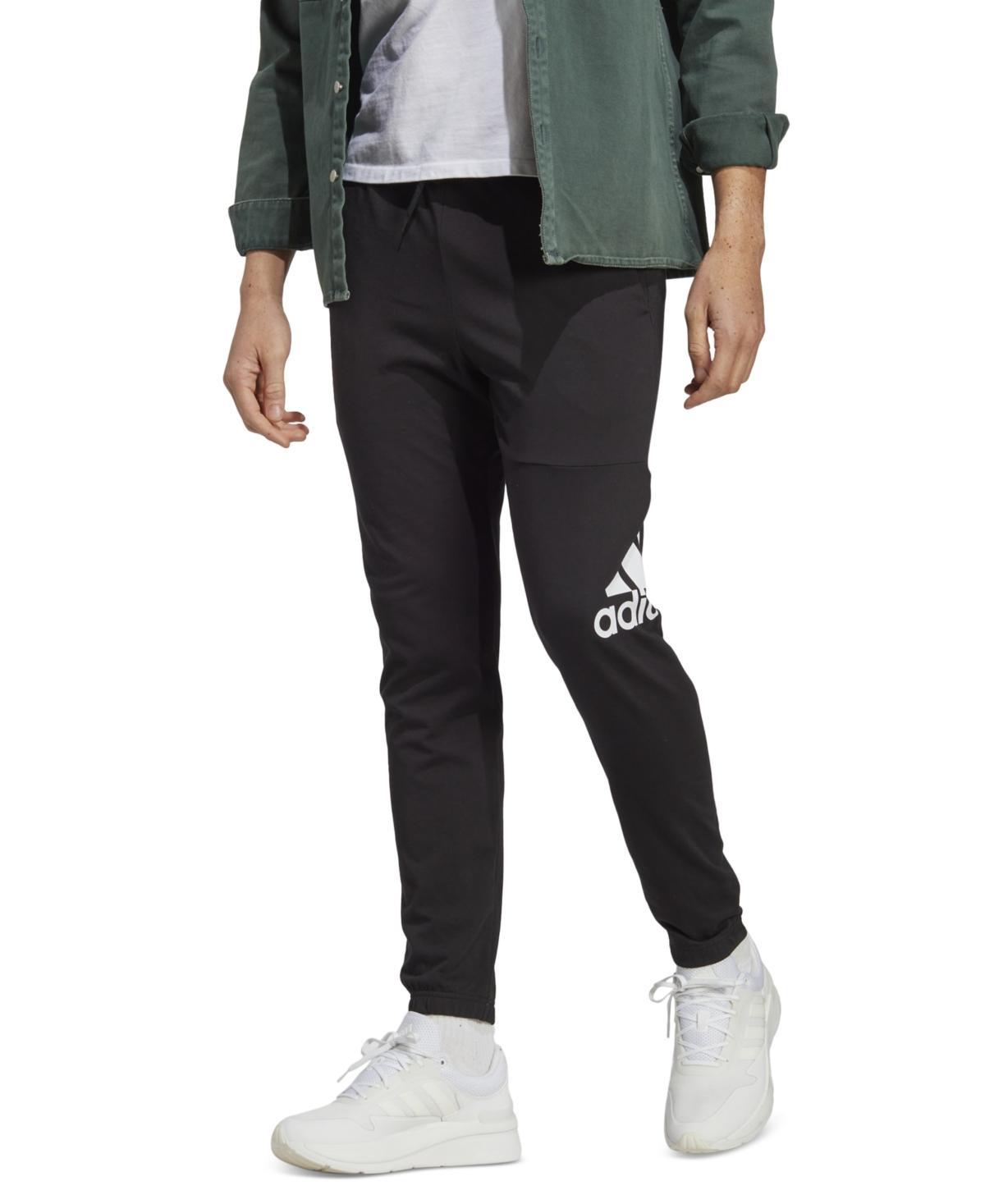 Mens adidas Essentials Badge of Sport Jersey Tapered Pants Dark Blue Product Image