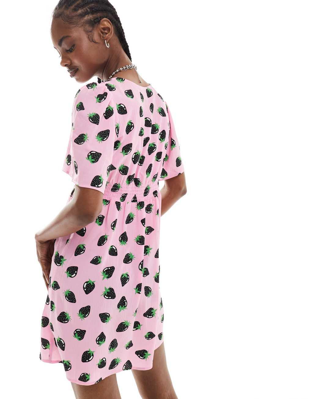 Monki short sleeve mini sun dress with v neck in pink and black strawberry print Product Image