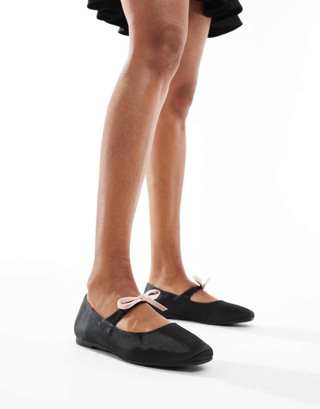 Glamorous bow ballet flats in black and cream Product Image