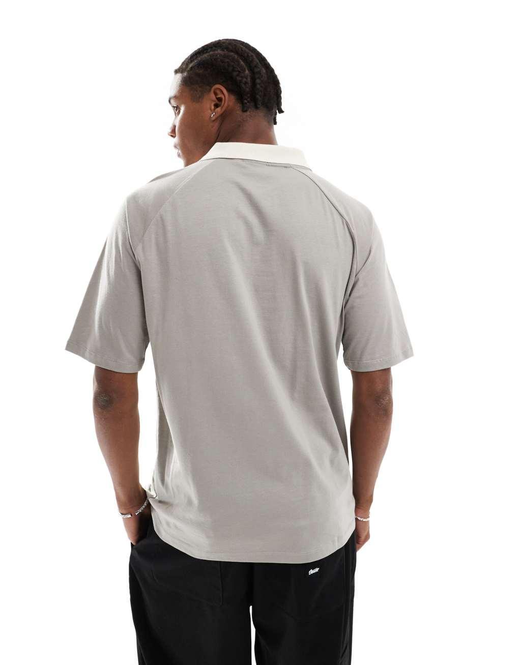 ASOS DESIGN relaxed raglan polo with cut and sew in khaki Product Image