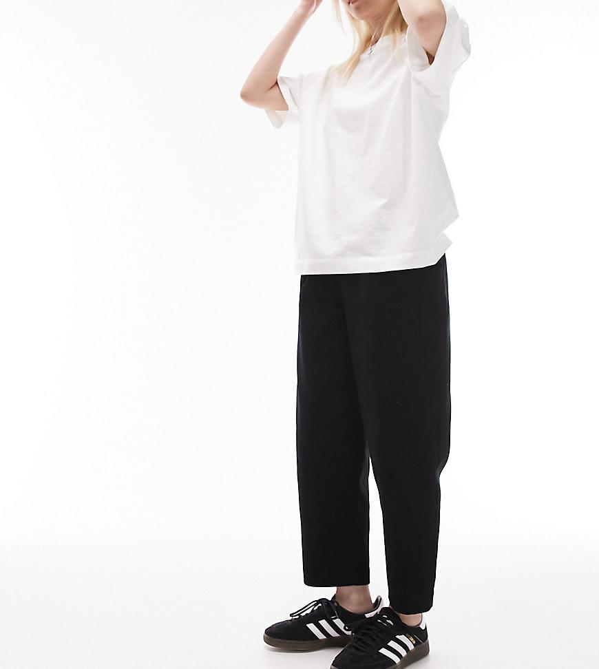 Topshop Petite cord peg pants in black Product Image