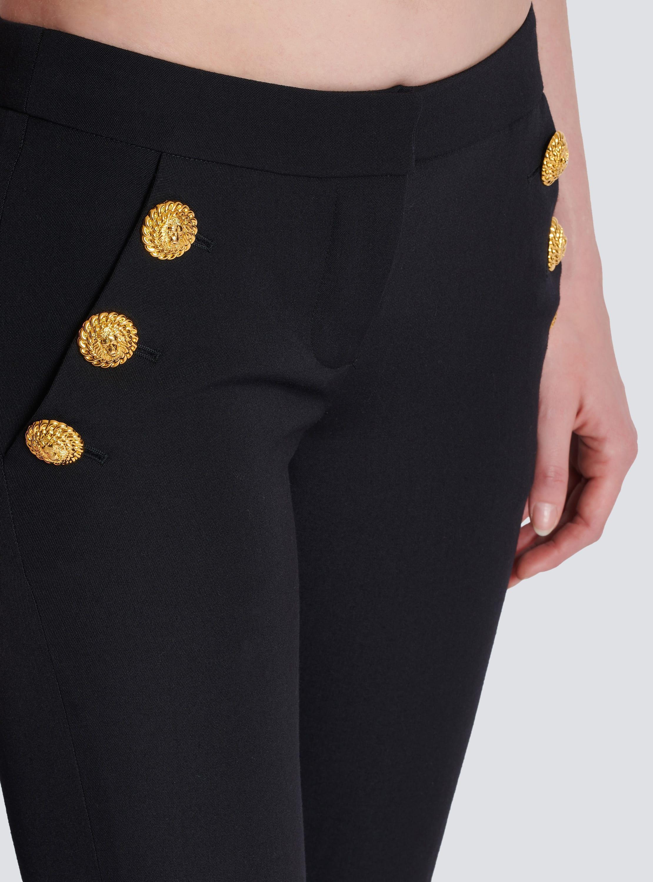 Flared trousers with buttons Product Image