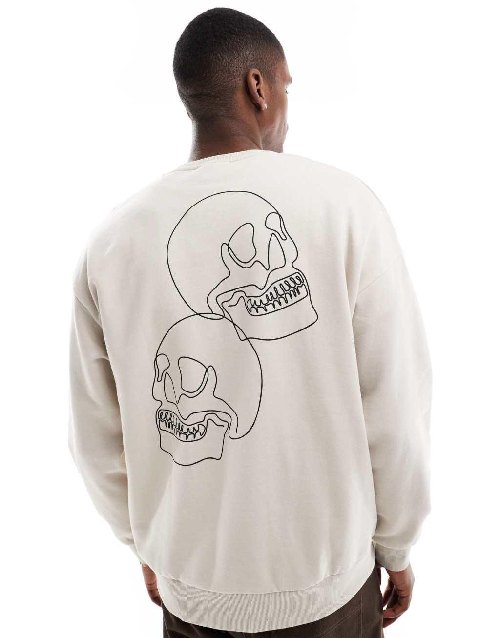 Jack & Jones drop shoulder crew neck sweatshirt with skull back print in beige product image