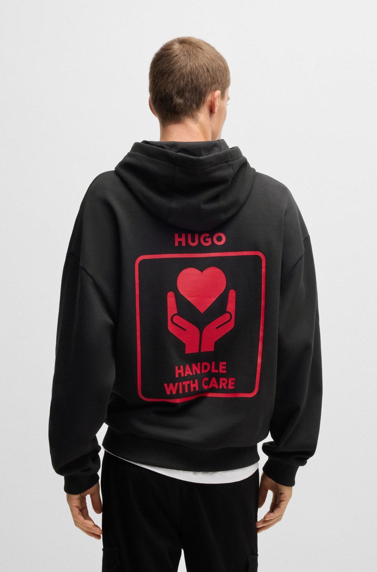 Cotton-terry hoodie with slogan and heart graphics Product Image