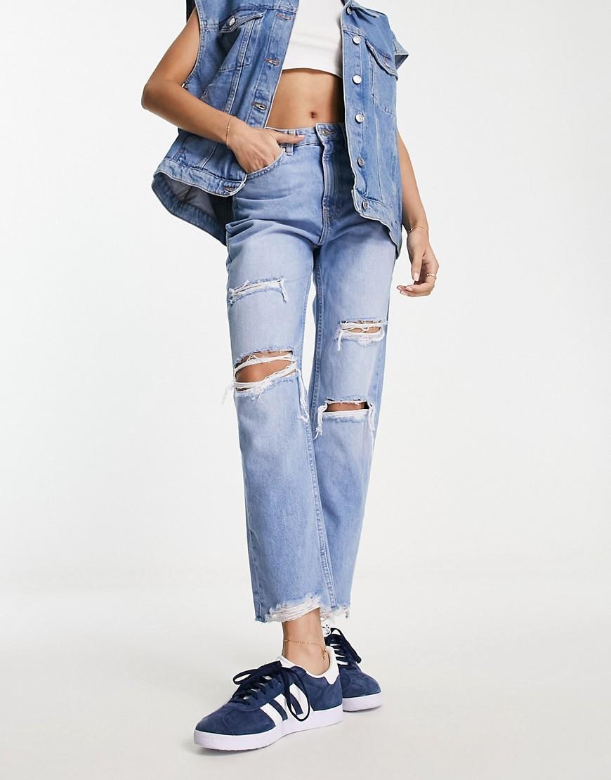 Bershka comfort fit mom jean with rips in light blue Product Image