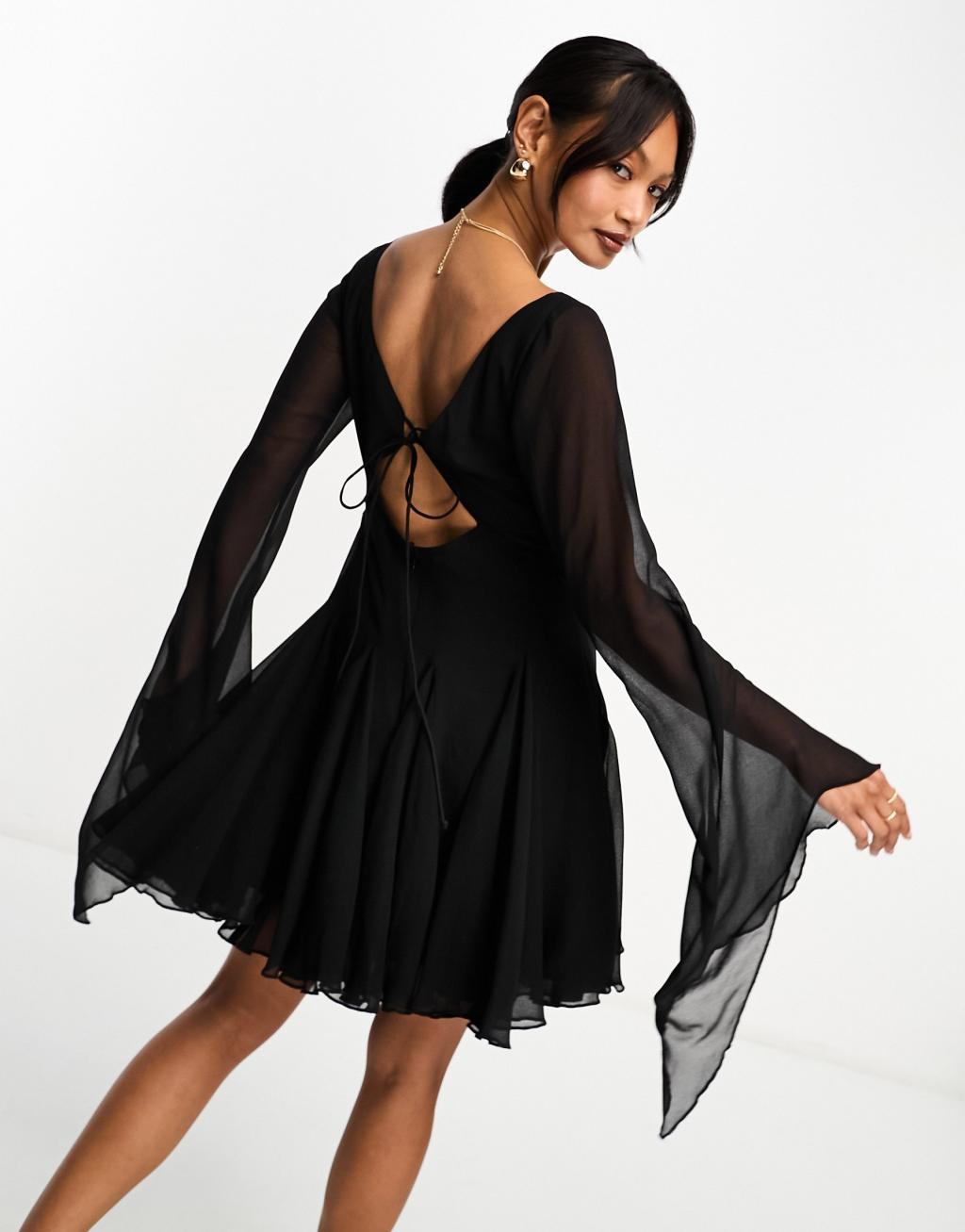 ASOS DESIGN mini dress with godet and asymmetric sleeve detail in black Product Image