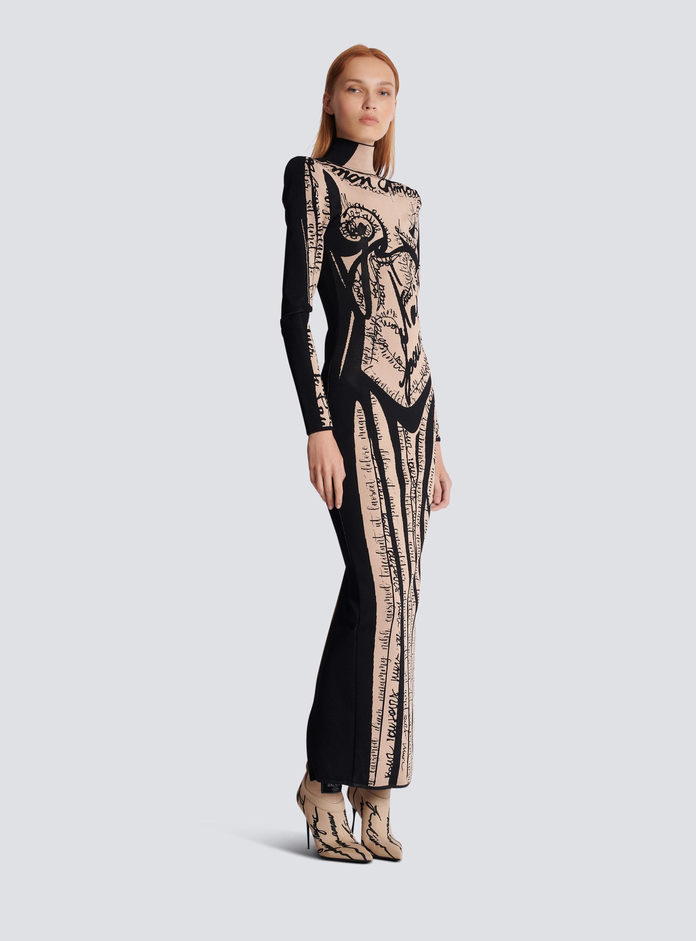 Long knit dress with body motif Product Image