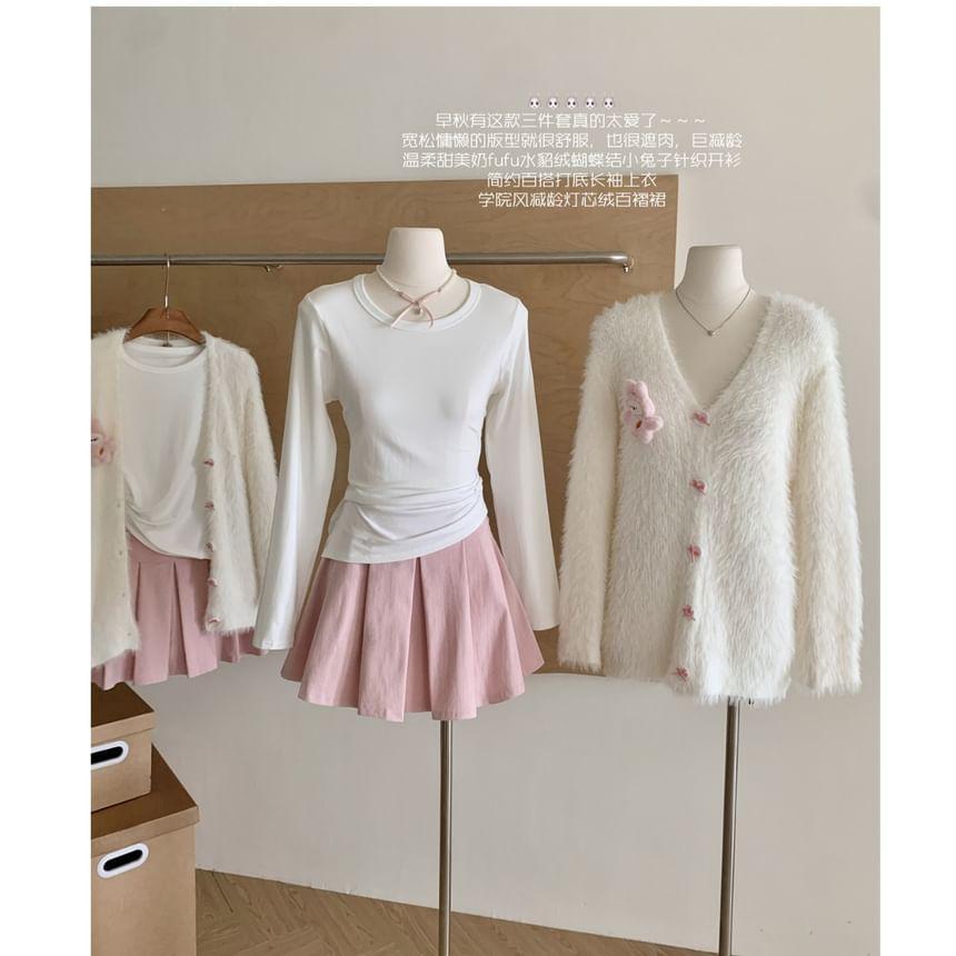 Set: V-Neck Cartoon Detail Bow Button Cardigan + Long Sleeve Crew Neck Plain Tee + High Rise Plain Pleated Mini A-Line Skirt Product Image