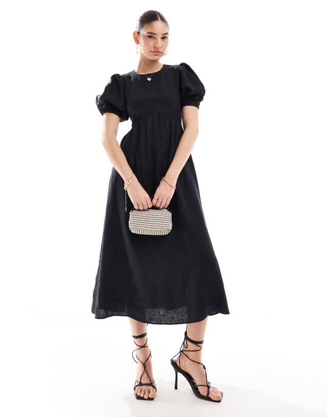 & Other Stories midi dress with volume sleeves and open back detail with tassels in black Product Image