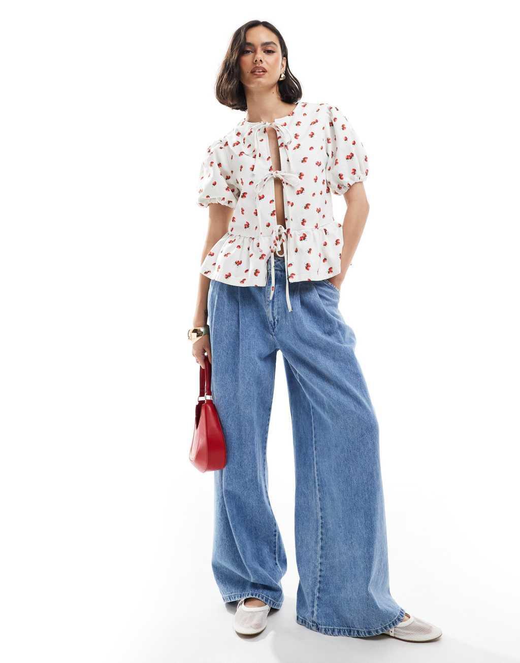 ASOS DESIGN denim puff sleeve tie front top in strawberry print Product Image