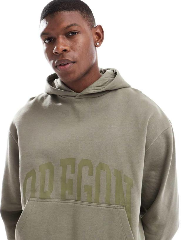 ASOS DESIGN boxy oversized hoodie with front print in khaki Product Image