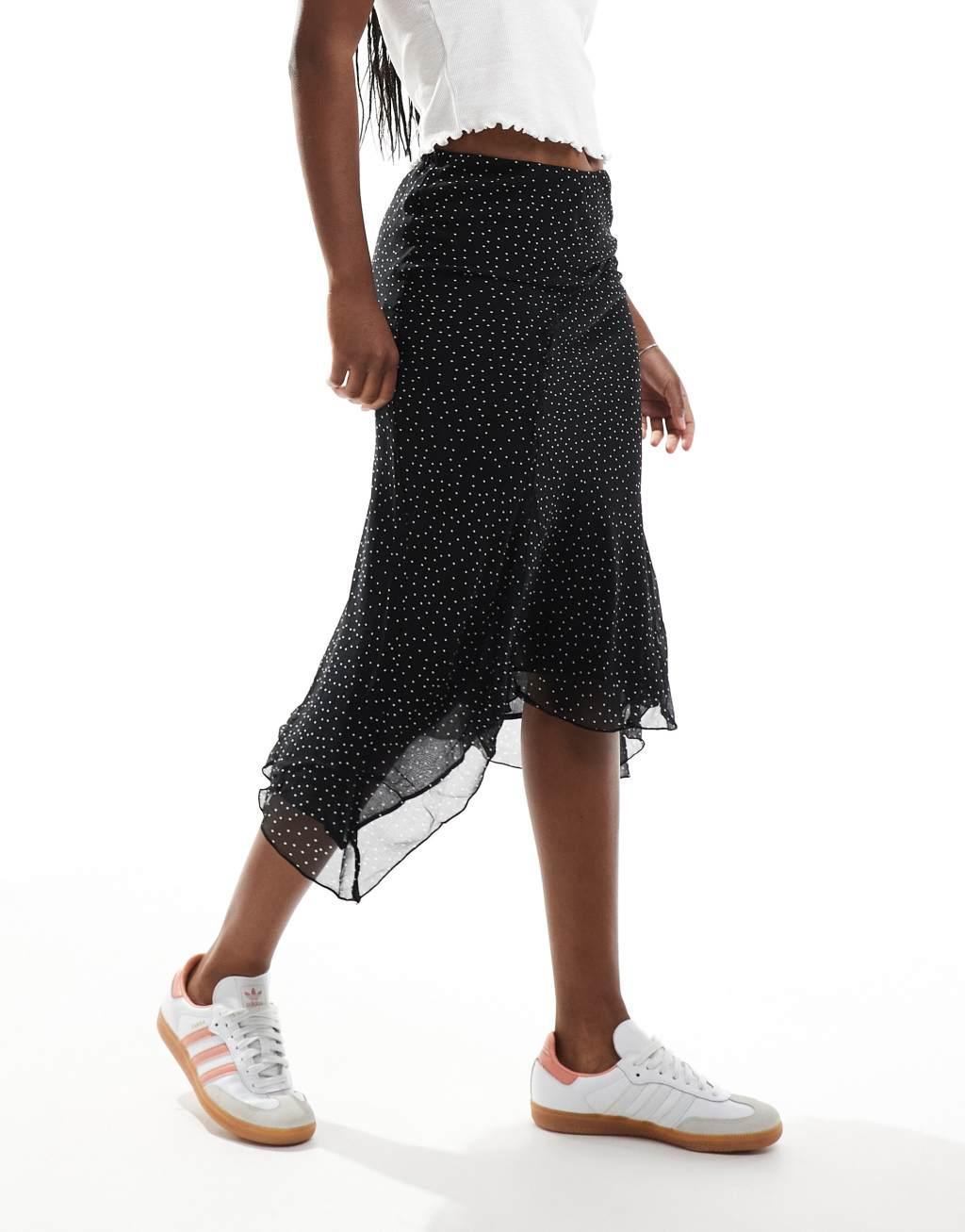 Mango asymmetric hem spot printed midi skirt in black Product Image