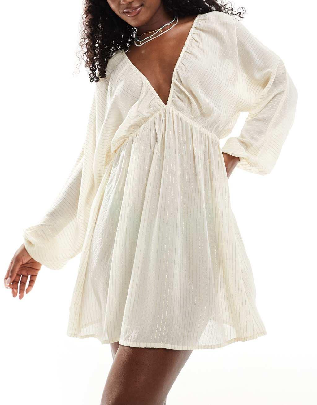 ASOS DESIGN plunge long sleeve sheer mini beach dress with metallic stripes in cream Product Image