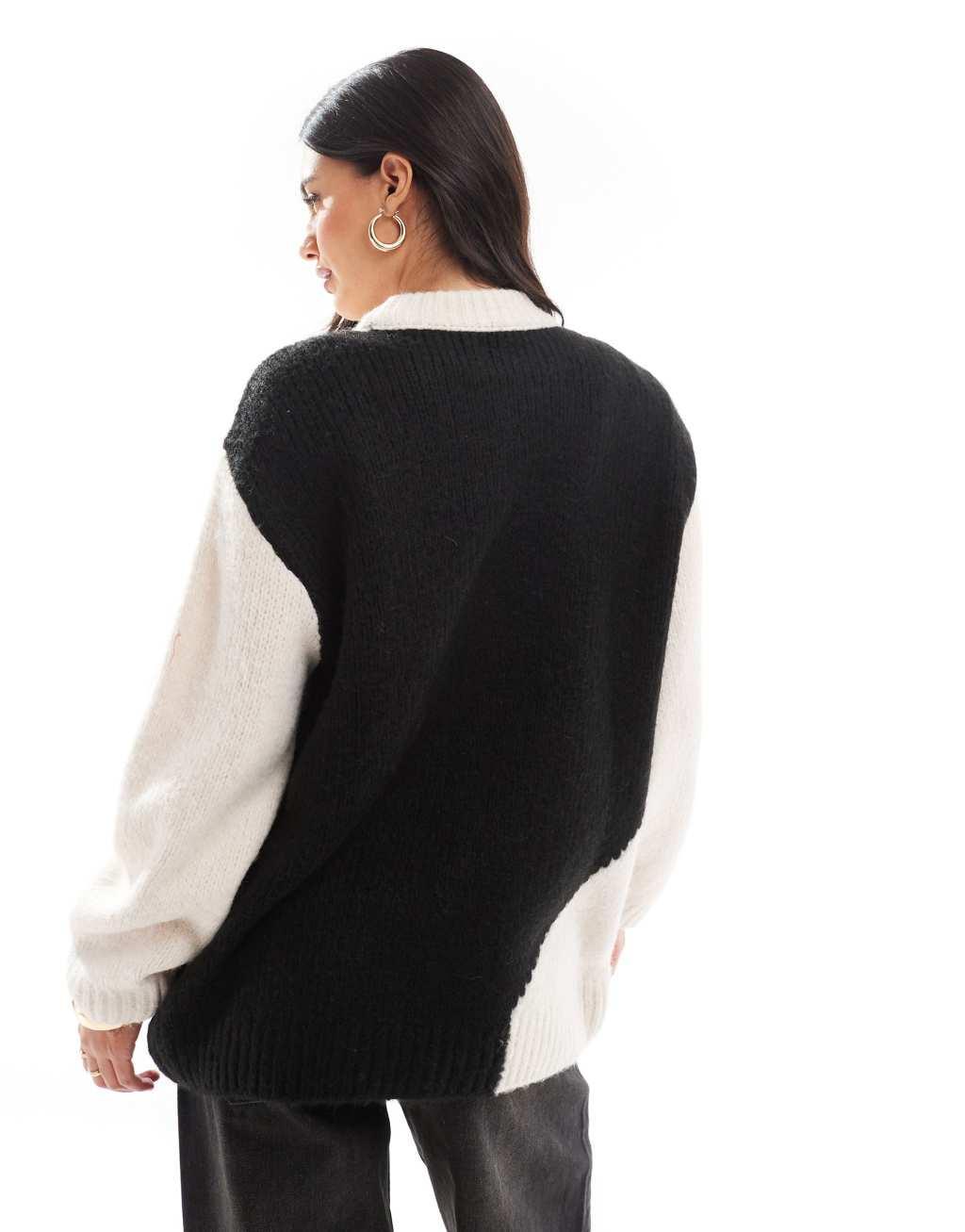 ASOS DESIGN crew neck color block sweater in black and white Product Image