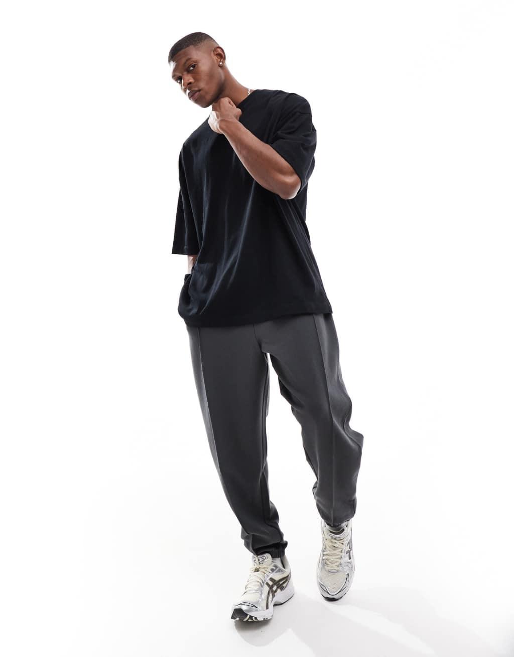 ASOS DESIGN oversized twill jersey sweatpants with pintucks in washed black Product Image