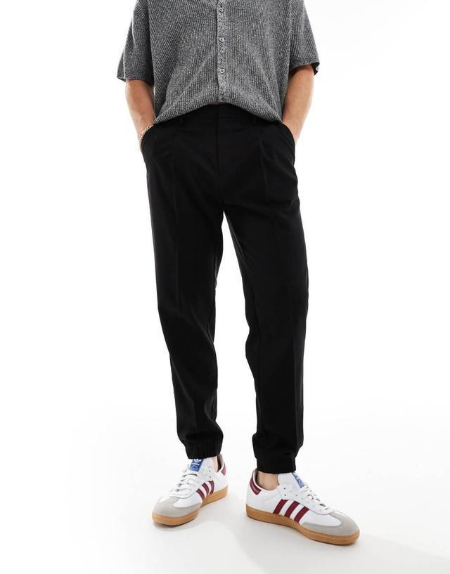 ASOS DESIGN tapered smart pants with sweatpants cuff in black Product Image