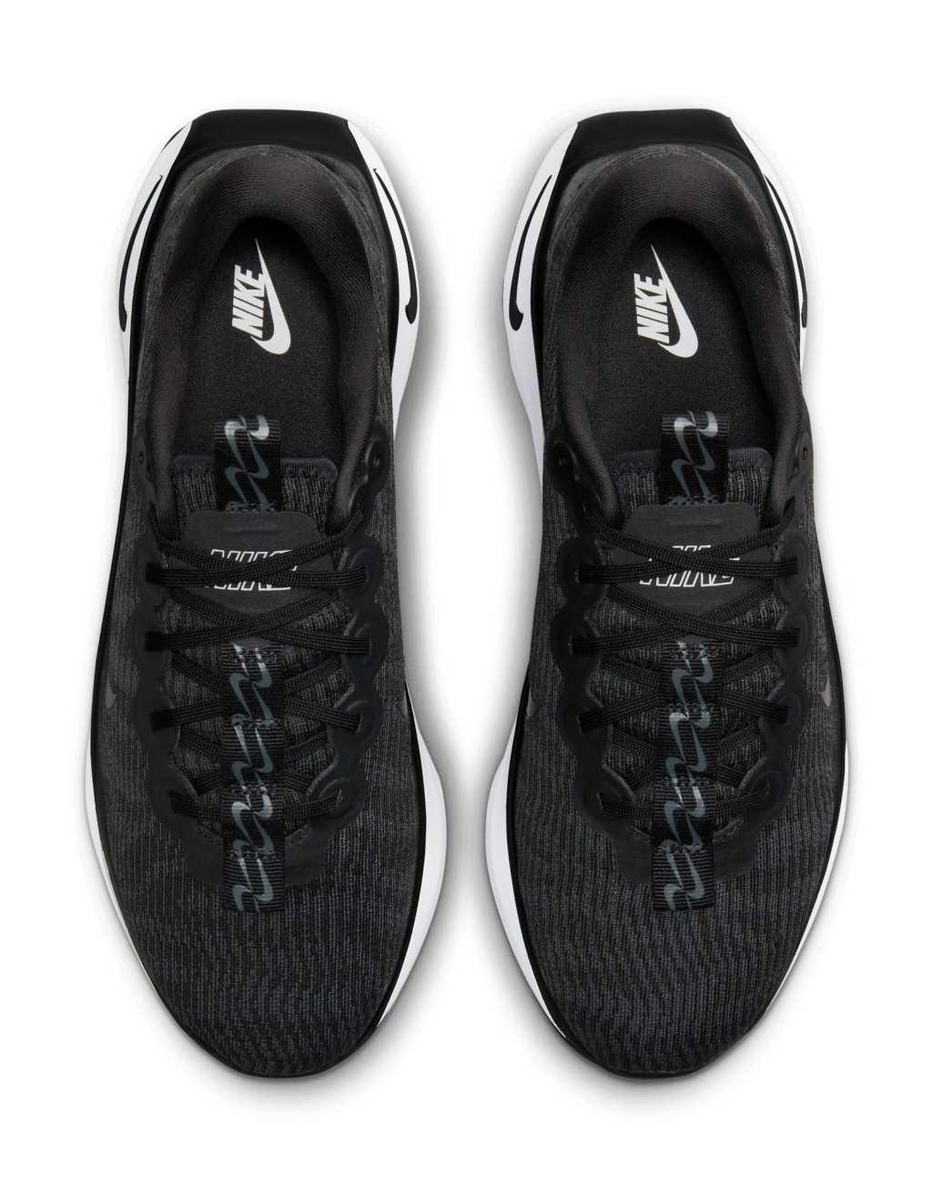 Nike Training Motiva sneakers in black and white Product Image