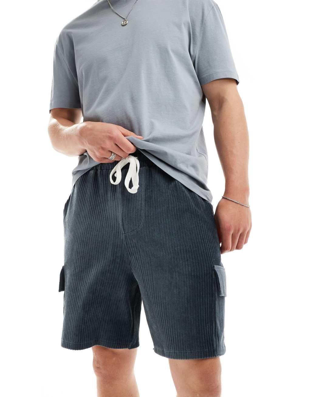 ASOS DESIGN oversized ribbed velour shorts in gray with cargo pockets Product Image