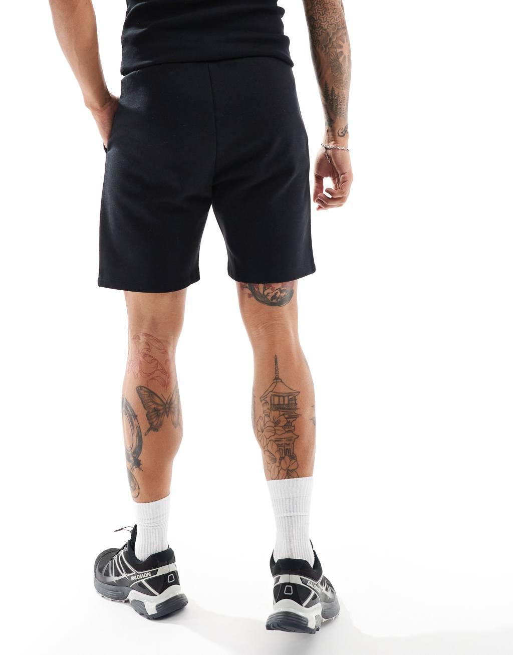 COLLUSION jersey shorts in black Product Image