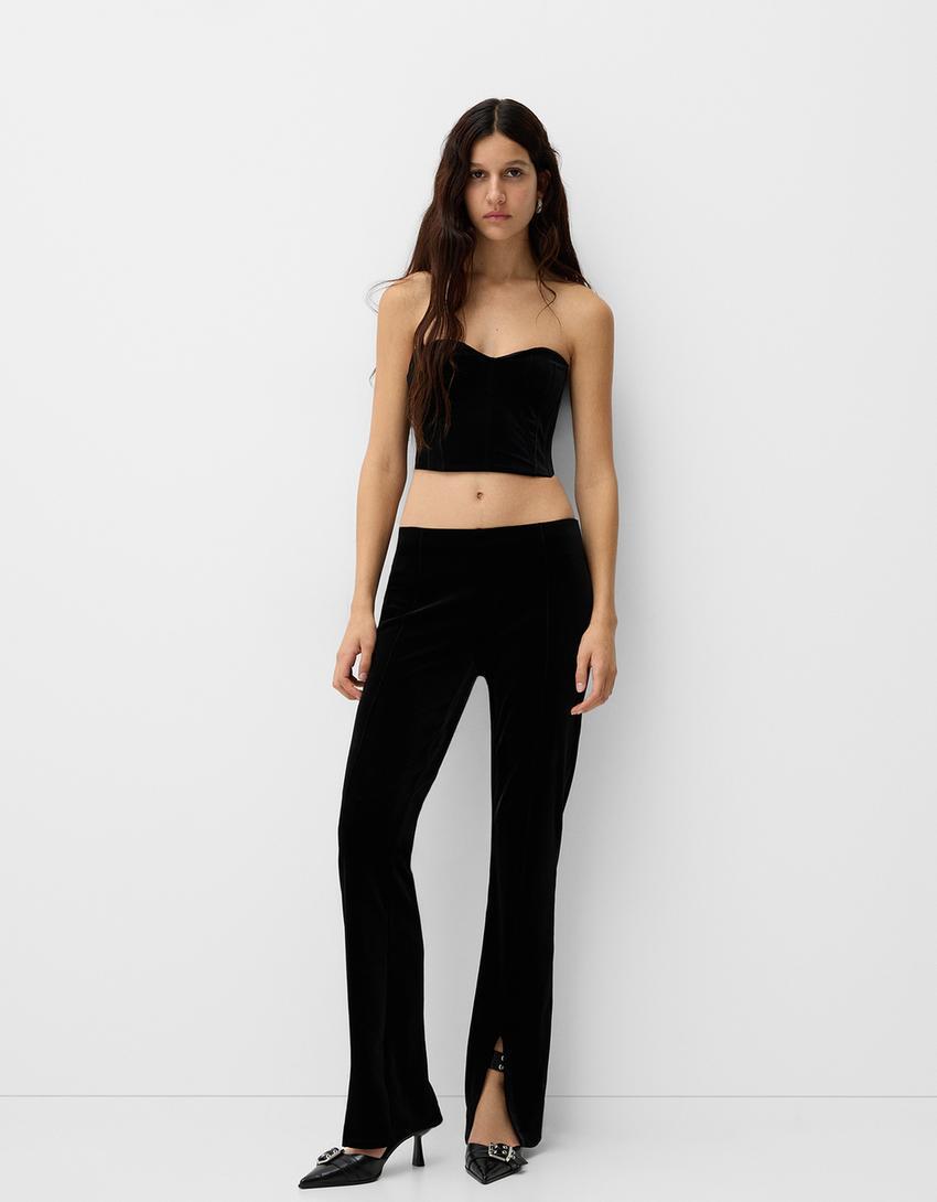 Flared velvet pants with slits Product Image