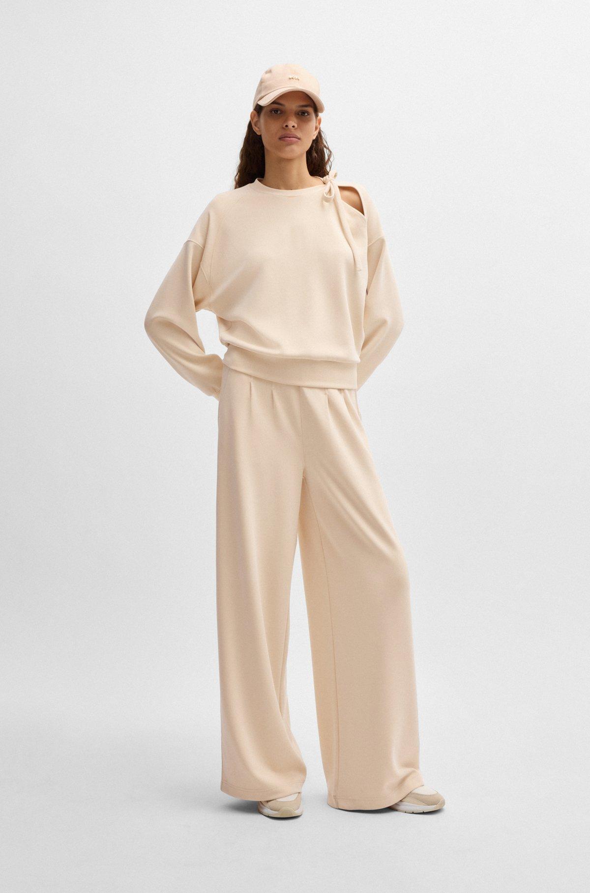 Wide-leg tracksuit bottoms with pleat details Product Image