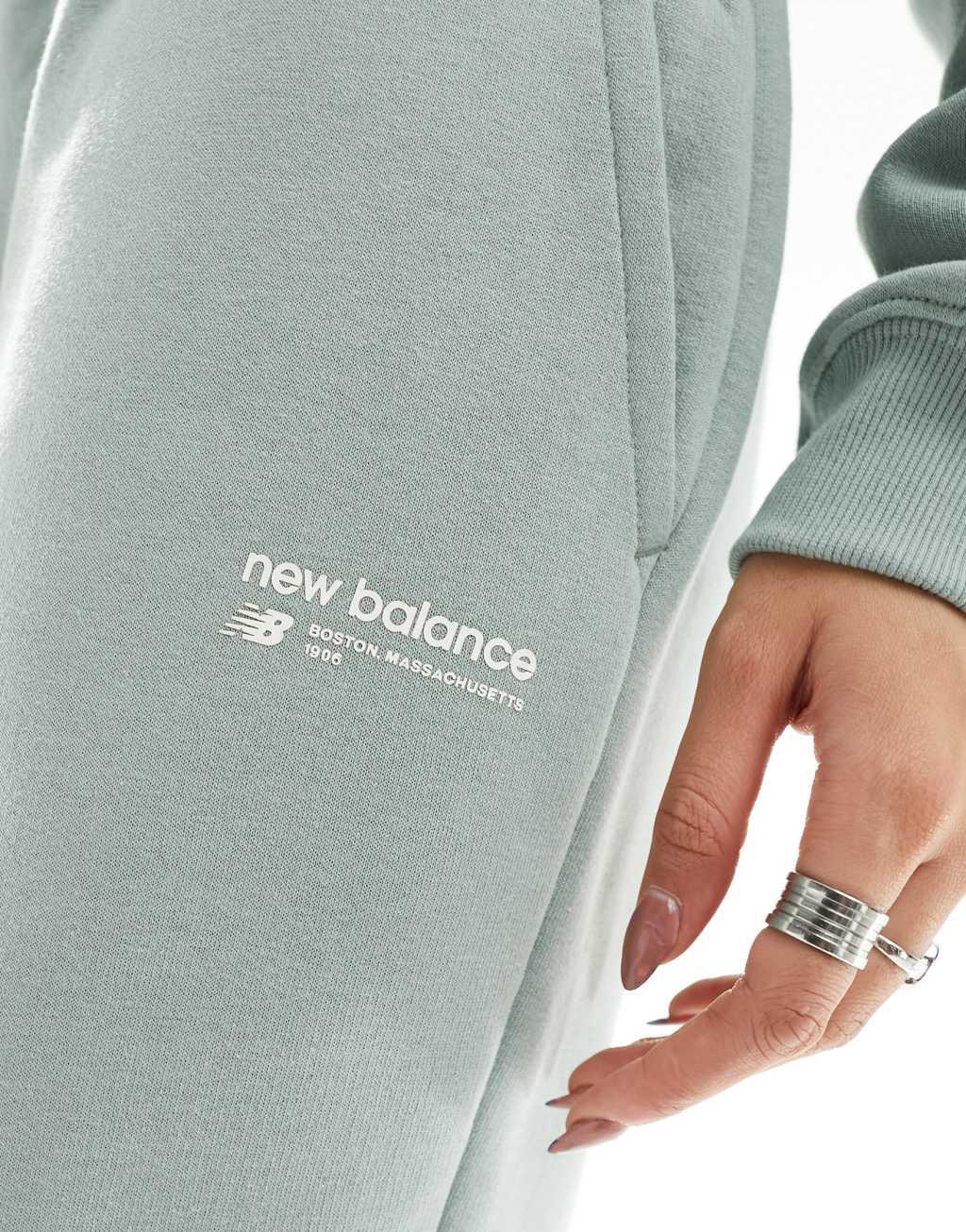 New Balance Linear Heritage brushed back track pants in light green Product Image