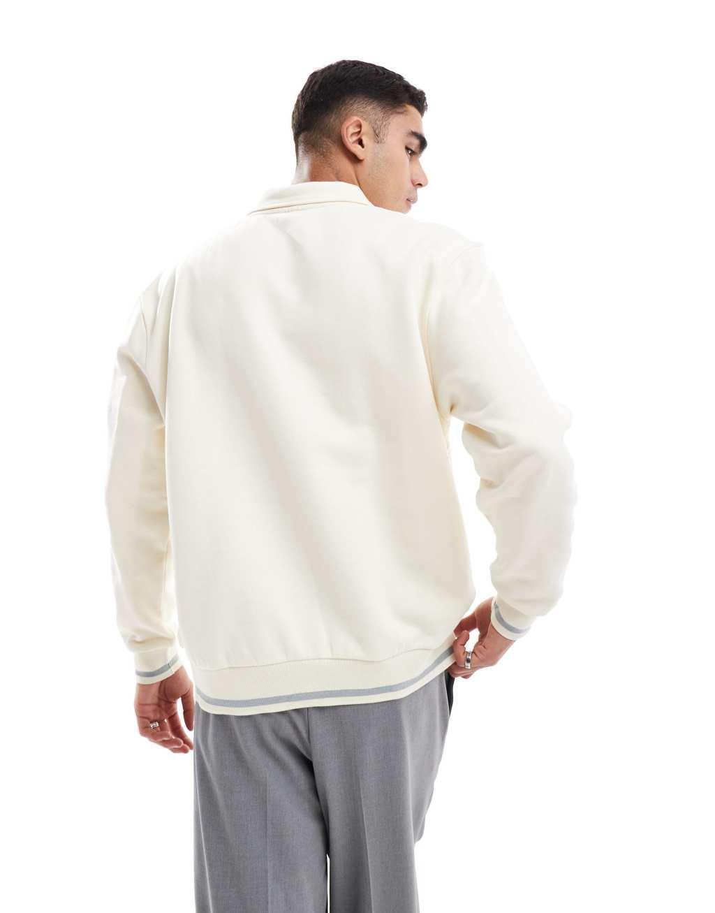 ASOS DESIGN oversized polo sweatshirt with NY print in beige Product Image