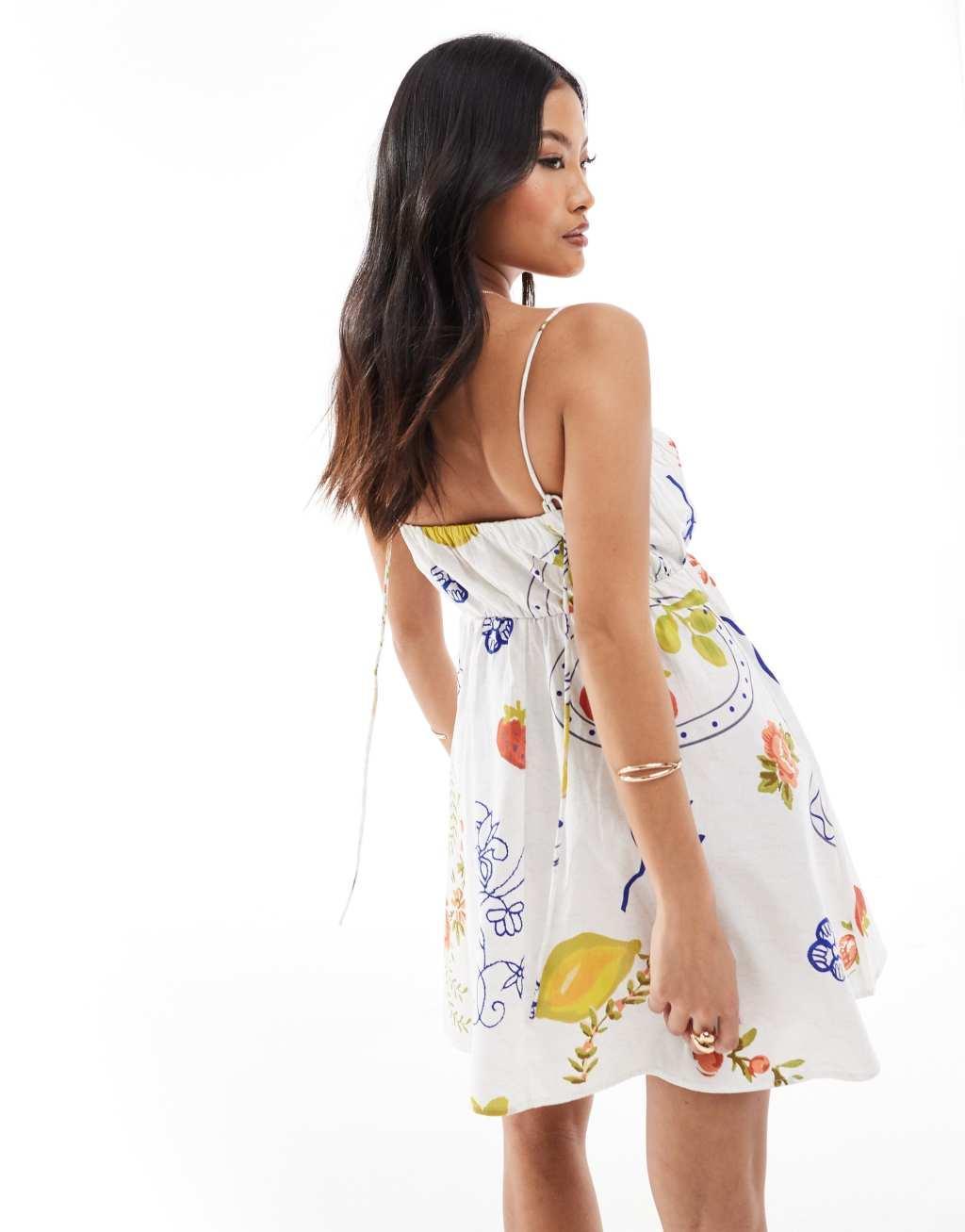 ASOS DESIGN Petite ruched bust mini sundress with adjustable straps in all over print Product Image