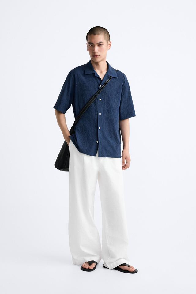 PLEATED WIDE FIT PANTS Product Image