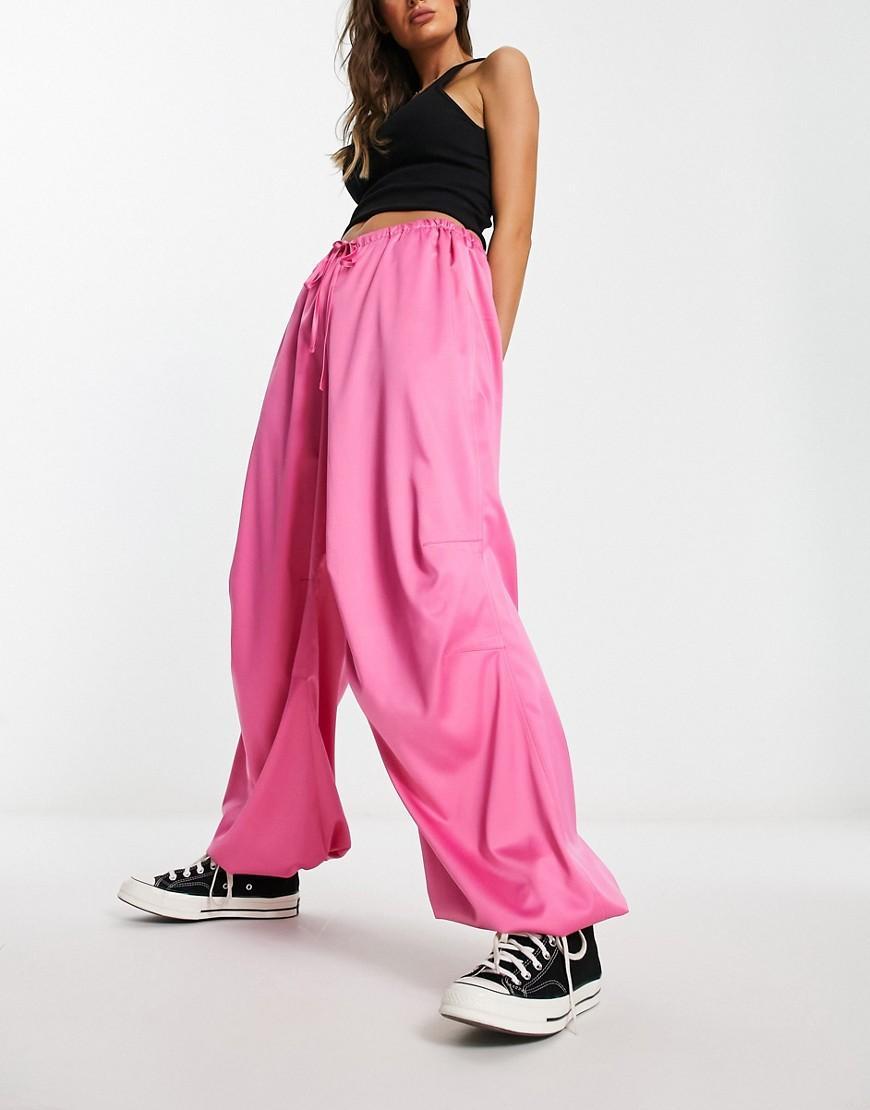 ASOS DESIGN satin parachute pants in pink Product Image