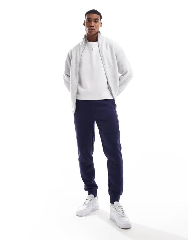 Nicce logo sweatpants in navy Product Image