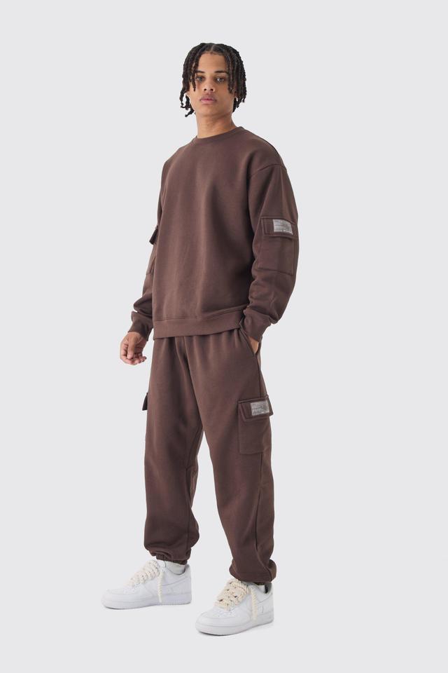 Oversized Man Tab Cargo Pocket Sweatshirt Tracksuit | boohooMAN USA Product Image