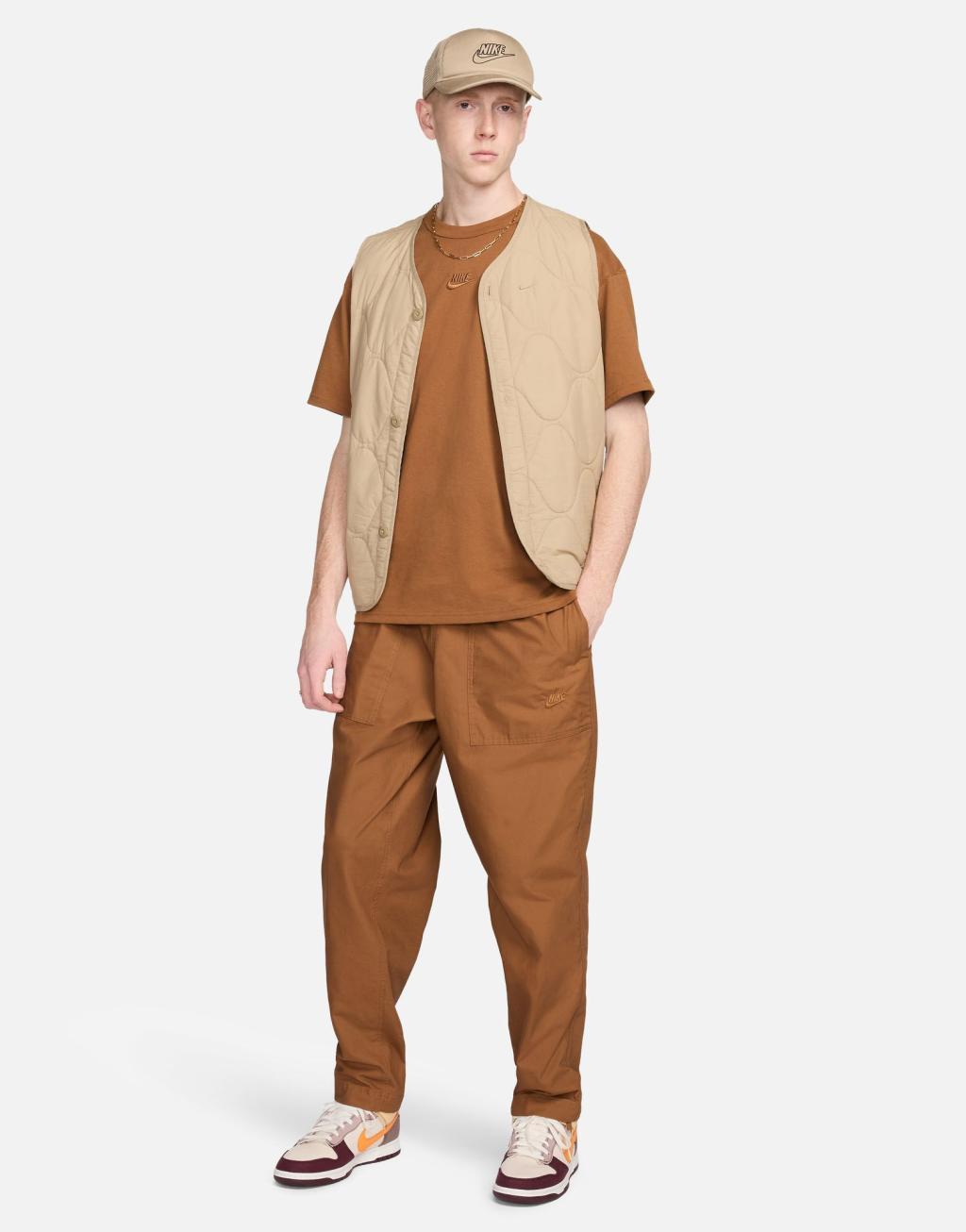 Nike Club woven Barcelona pants in brown Product Image