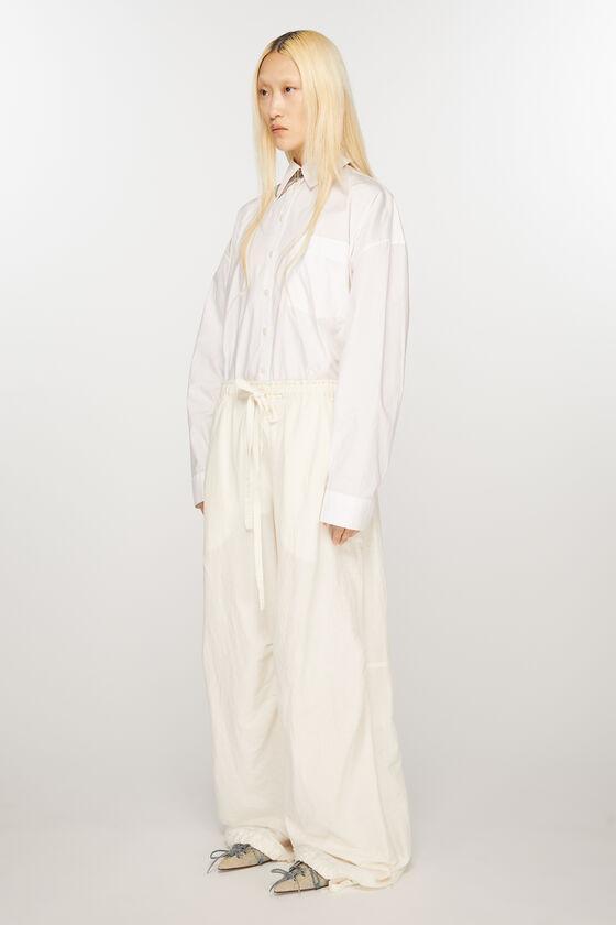 Relaxed drawstring trousers Product Image