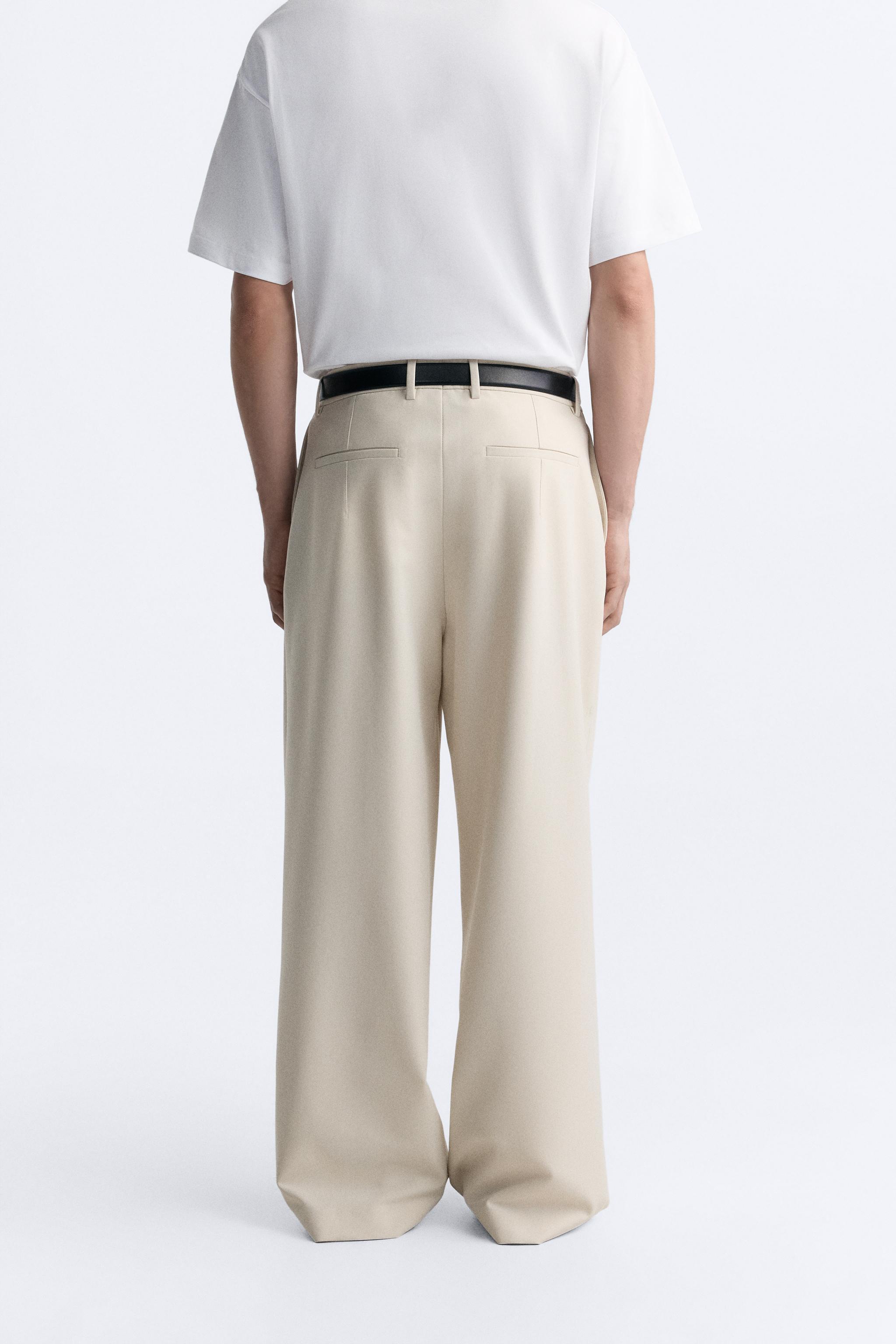 PLEATED WIDE FIT PANTS Product Image