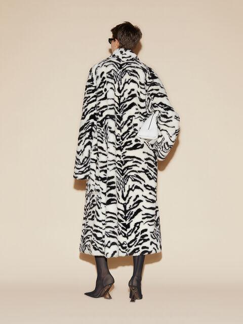 White and black long fur coat Product Image