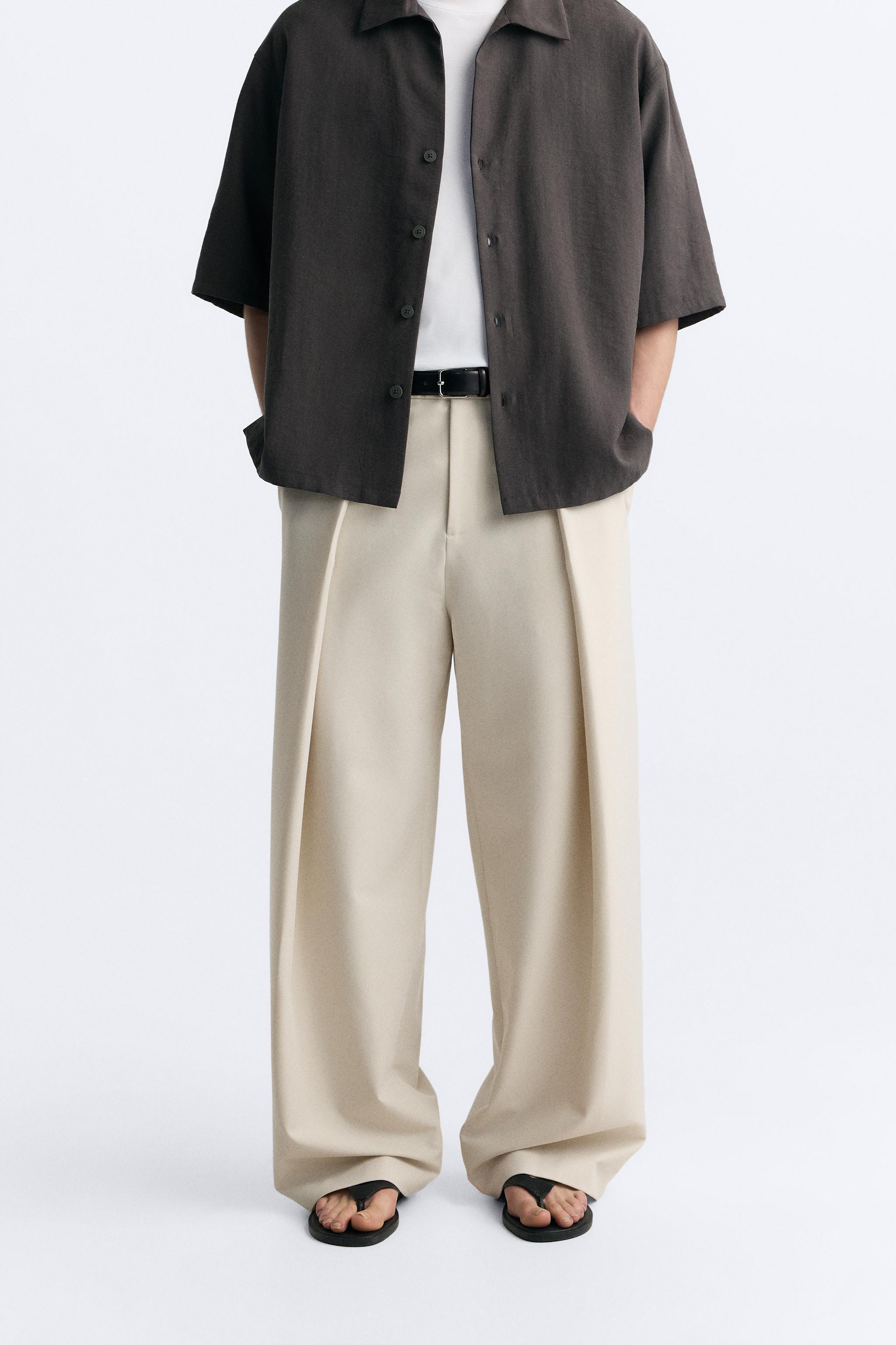 PLEATED WIDE FIT PANTS Product Image