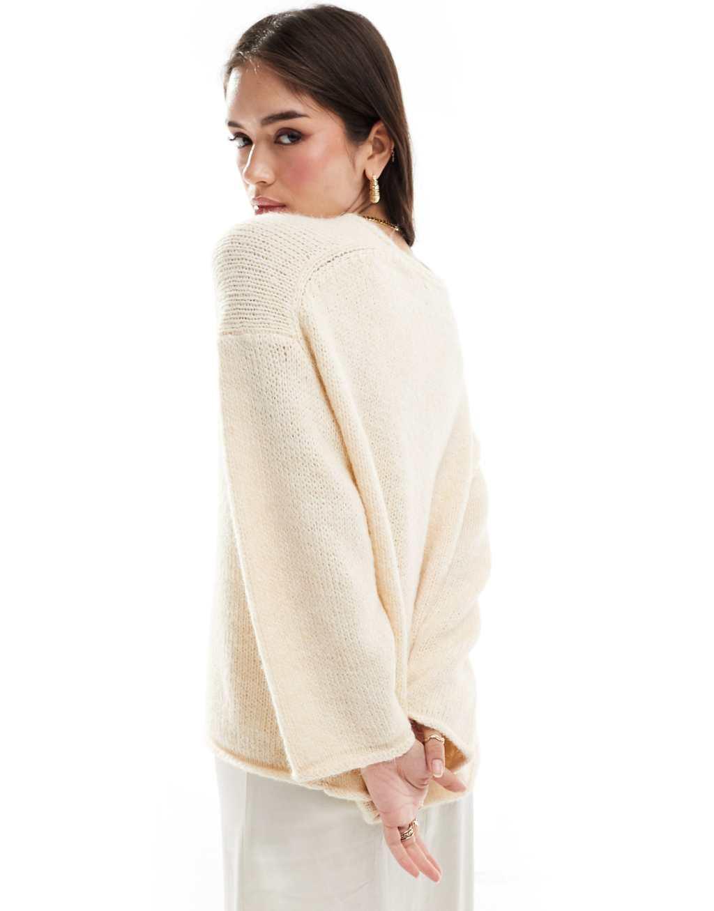 ASOS DESIGN loose knit v neck longline sweater in cream Product Image