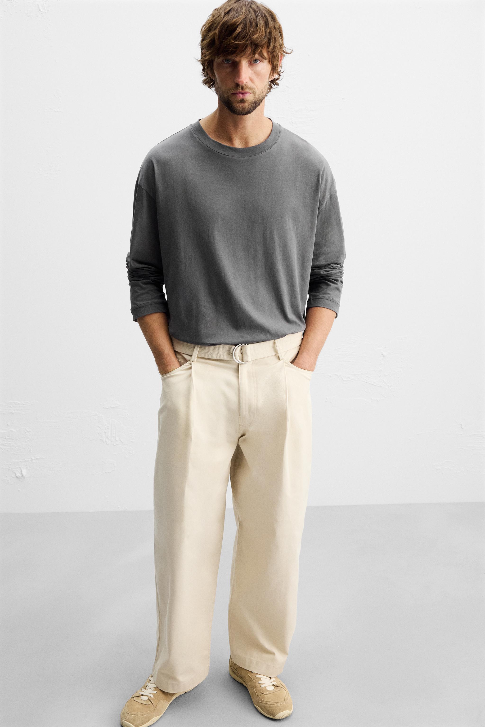 PLEATED PANTS WITH BELT Product Image