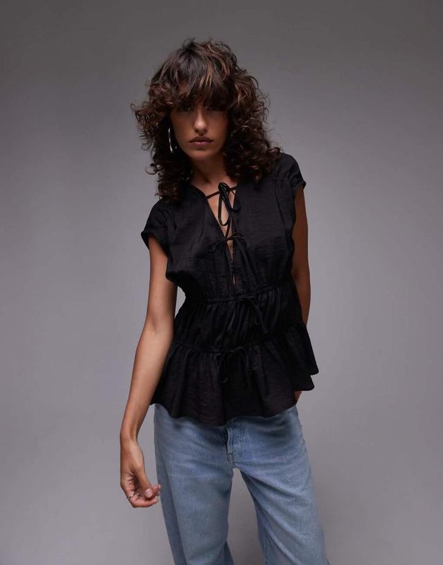 Topshop sleeveless tie front tiered top in black Product Image