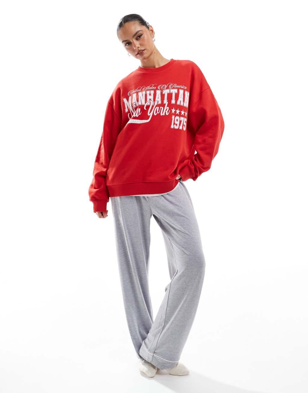 ASOS DESIGN oversized sweatshirt with Manhattan graphic in red Product Image