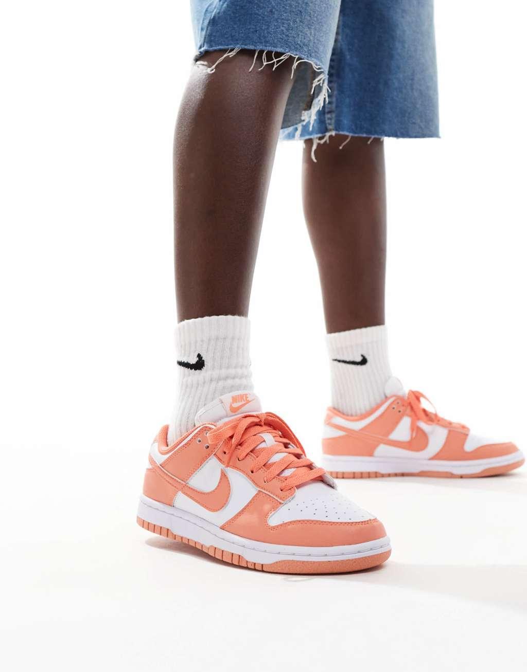 Nike Dunk Low sneakers in white and orange Product Image