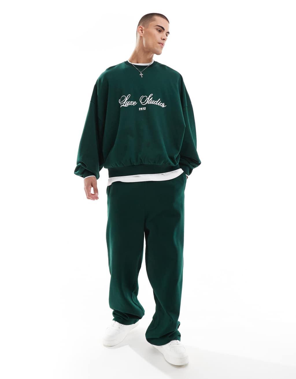 ASOS DESIGN wide leg sweatpants with contrast side tape in dark green Product Image