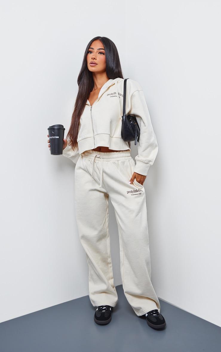 PRETTYLITTLETHING Petite Cream Premium Print Wide Leg Joggers Product Image