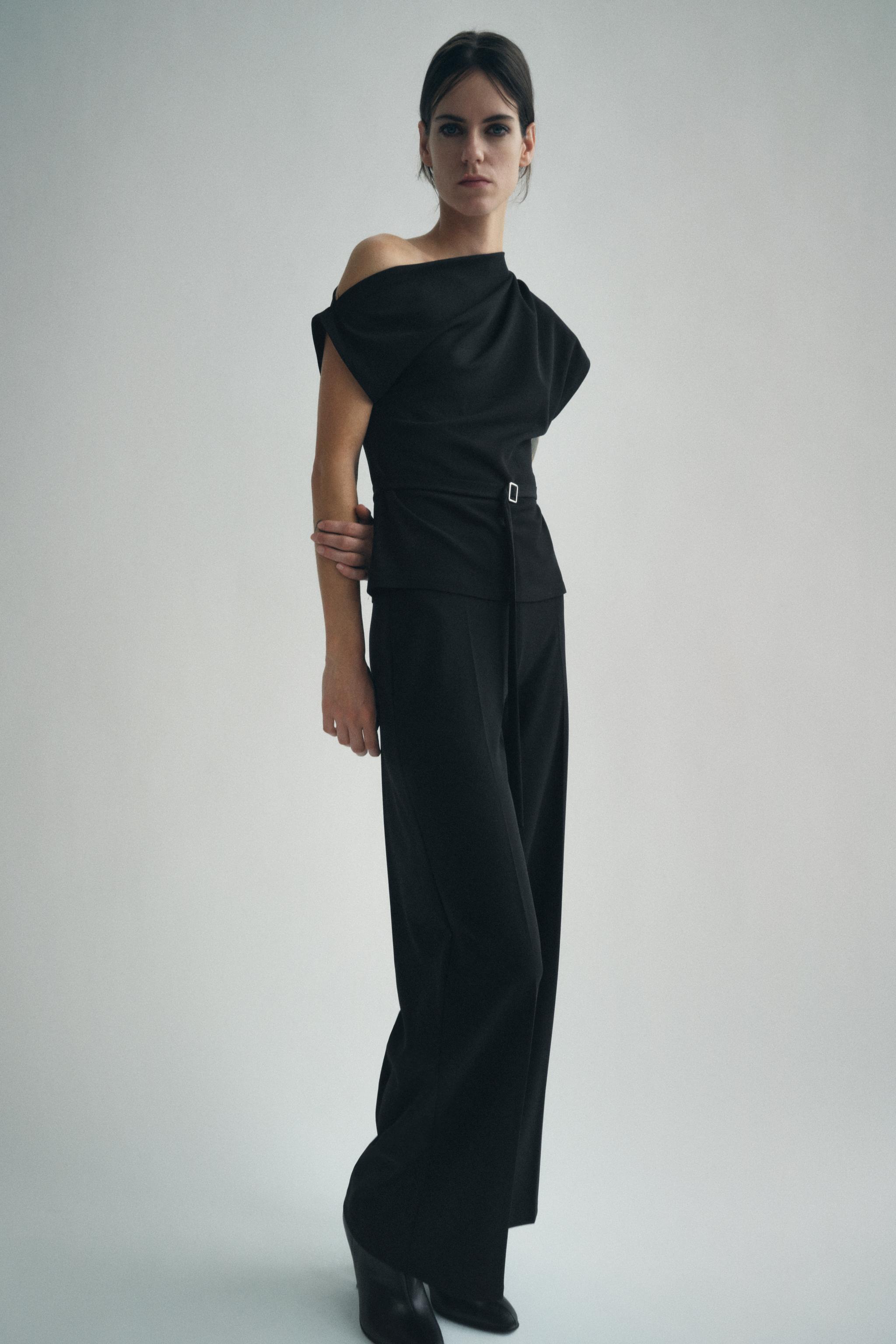 Wide leg pants with a high waist. Hidden zip closure at side. Product Image