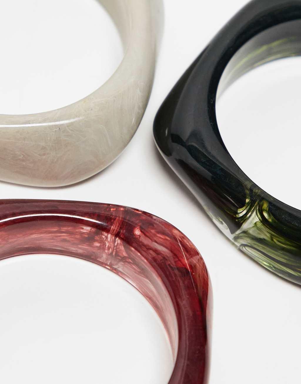 ASOS DESIGN pack of 3 resin bangles in burgundy and green Product Image