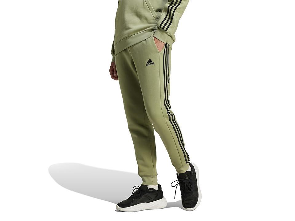 adidas Essentials Fleece 3-Stripes Tapered Cuff Pants (Tent Green) Men's Clothing Product Image