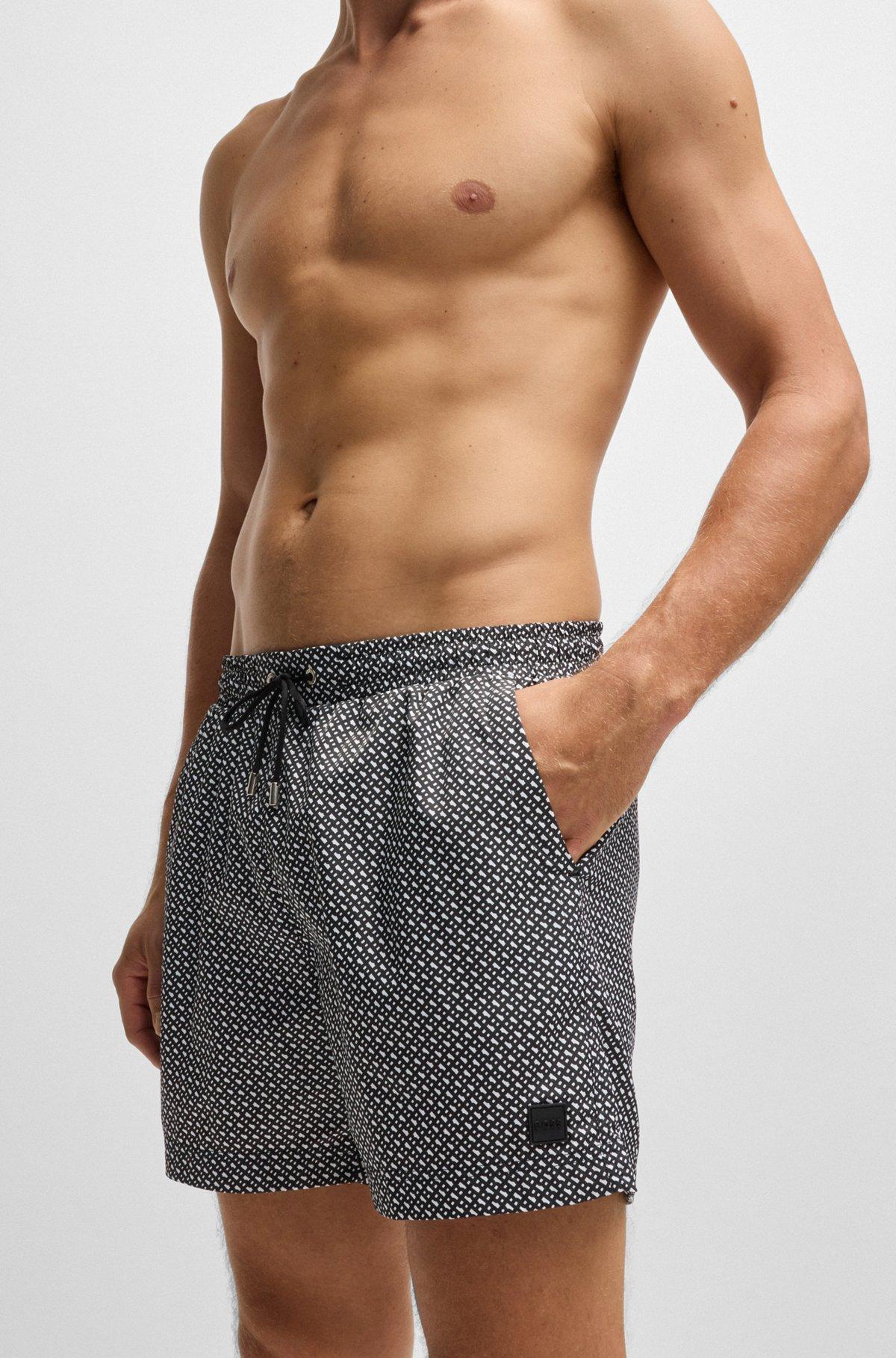 Monogram-print swim shorts in quick-dry fabric Product Image