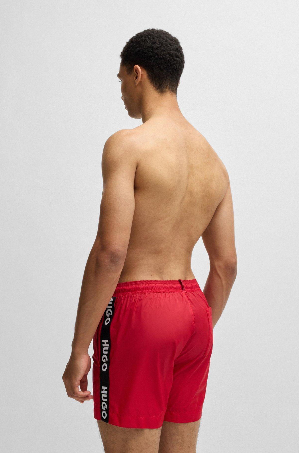 Fully lined swim shorts with logo tape Product Image