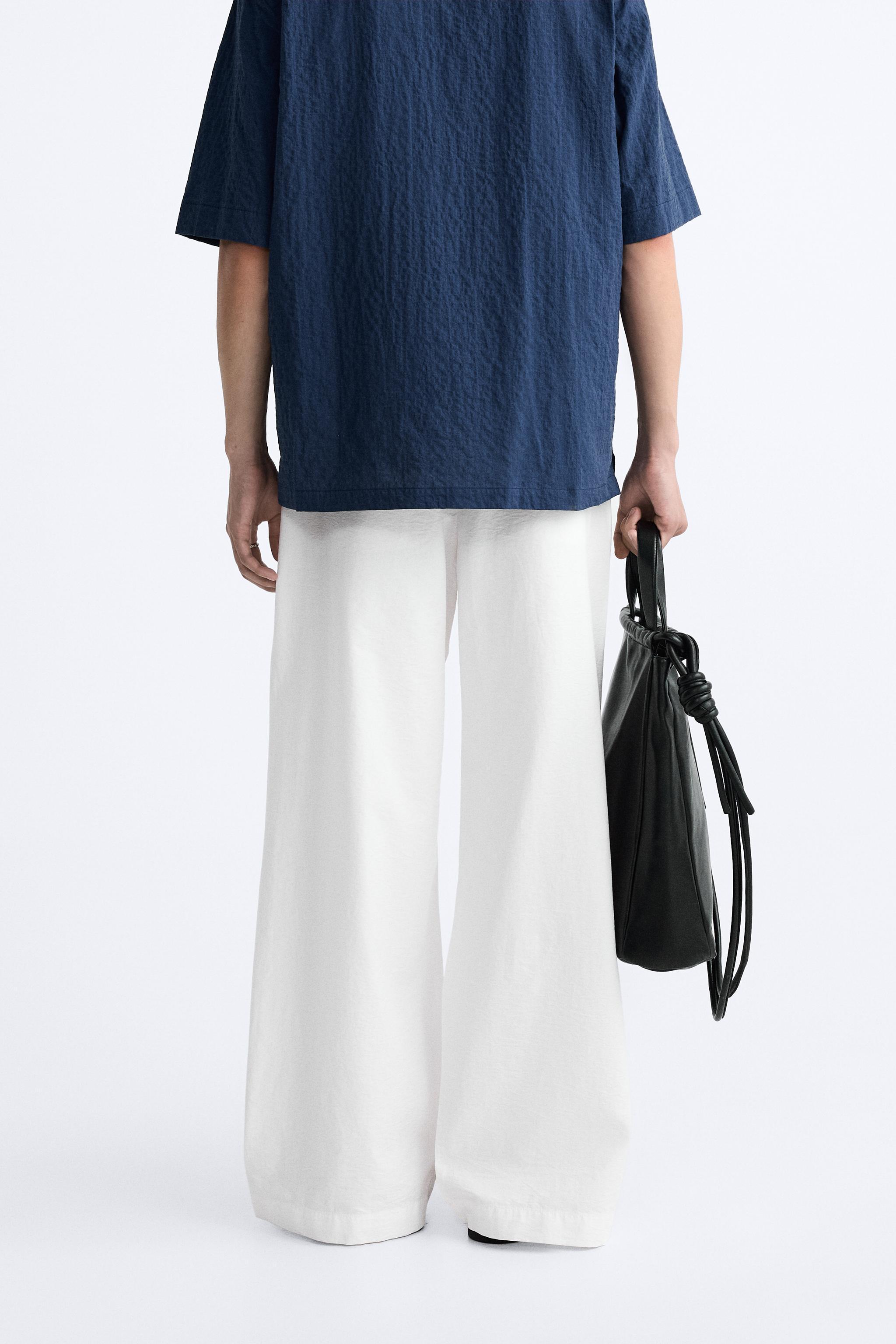 PLEATED WIDE FIT PANTS Product Image